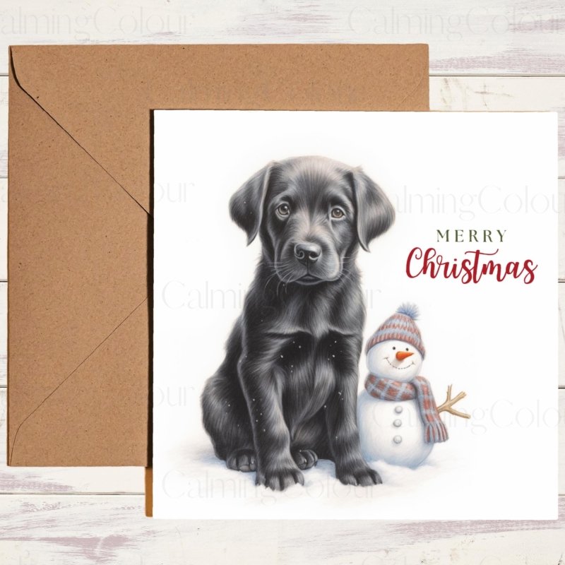 Black Labrador puppy with snowman Christmas card - Calming Colour