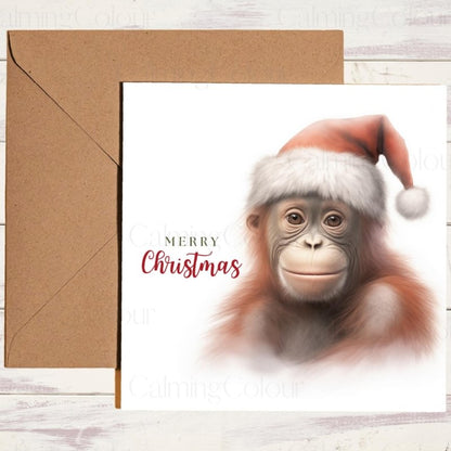 Young Orangutan Wearing a Santa Hat | Christmas Card | Christmas Card